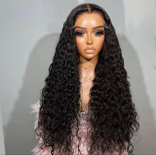 Black water wave HD lace front wig worn by model showing ultra-long loose wave texture, undetectable HD lace melt and natural centre part, Grade 12A
